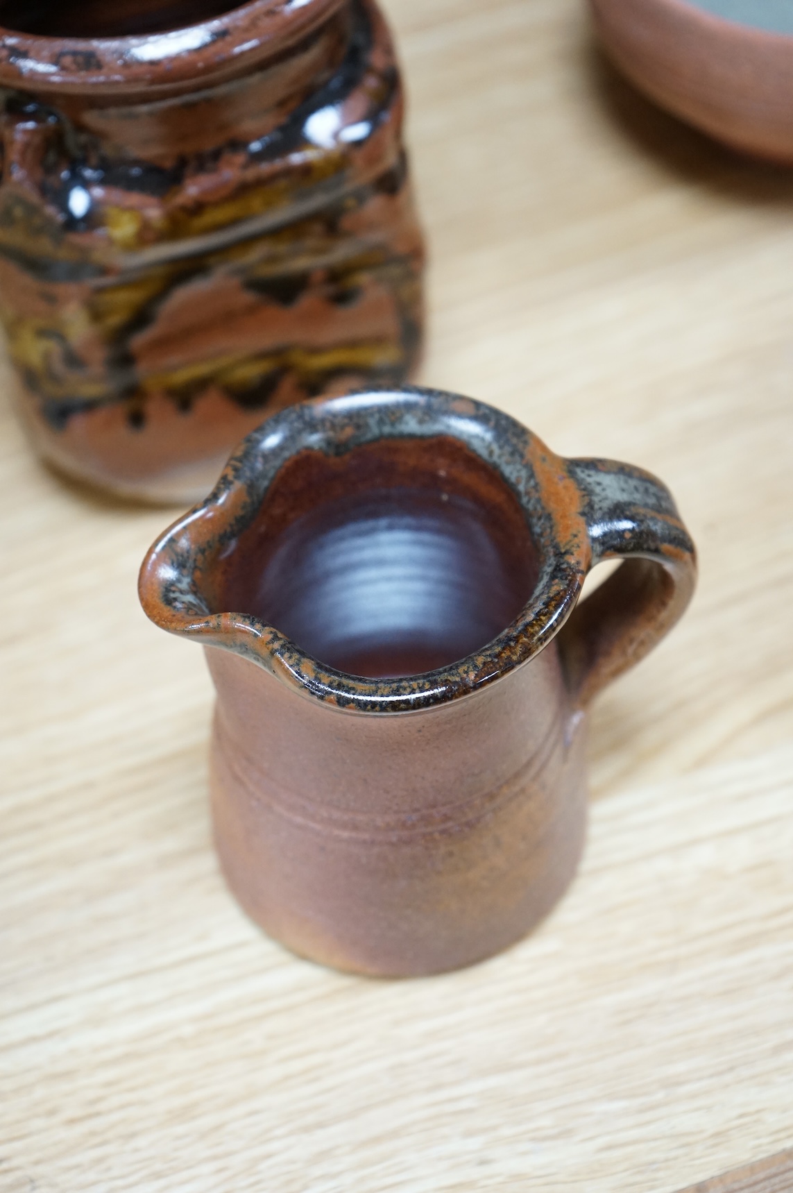 A large group of 20th century signed and unsigned Studio pottery, tallest 23cm high